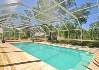 Pool sunroom, swimming pool enclosure, sliding doors, retractable cover